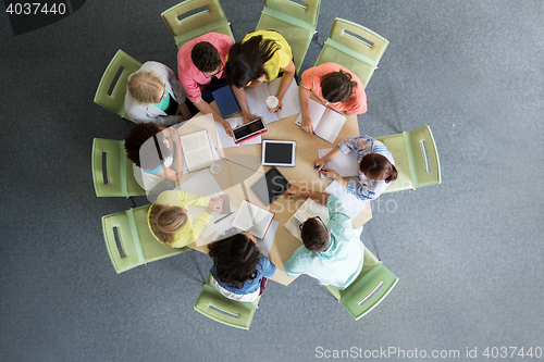 Image of group of students with tablet pc at school library