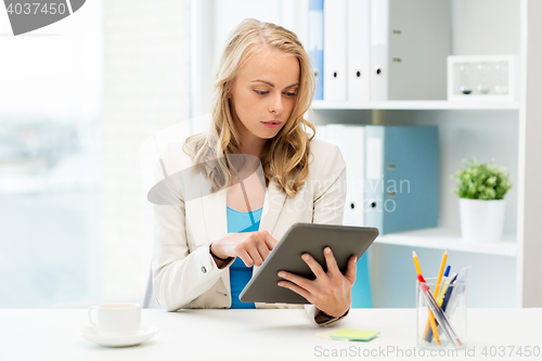 Image of businesswoman or student with tablet pc at office