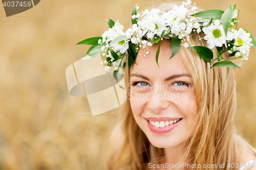 Image of happy woman in wreath of flowers