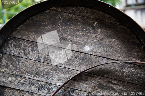 Image of close up of old wooden barrel outdoors