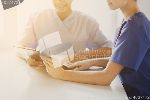 Image of close up of doctors with clipboard at hospital
