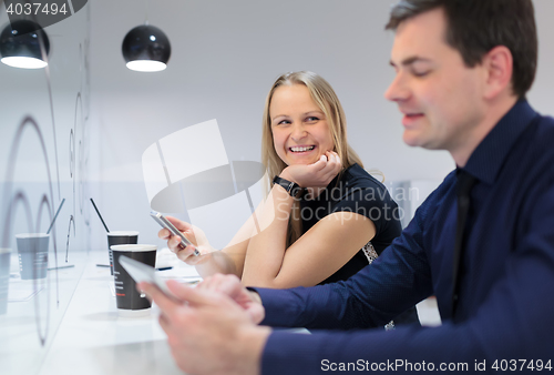 Image of Businessman and woman in a meeting