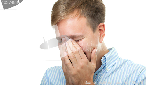 Image of Laughing man hiding the face isolated on white