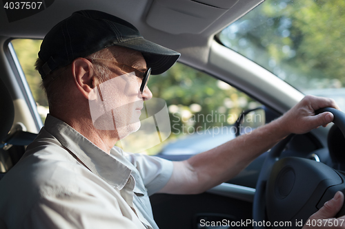 Image of Senior man at the wheel