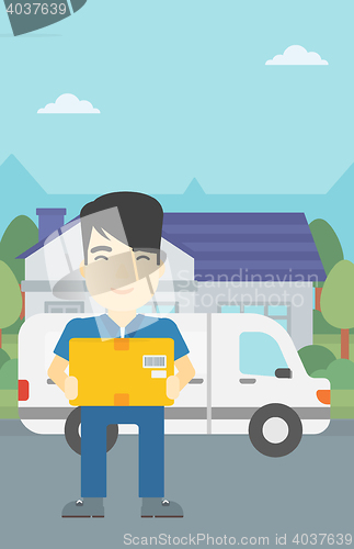 Image of Delivery man carrying cardboard boxes.