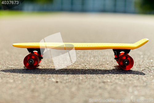 Image of close up of short modern cruiser skateboard