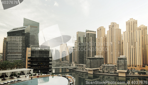 Image of Dubai city seafront with hotel infinity edge pool