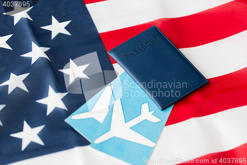 Image of american flag, passport and air tickets