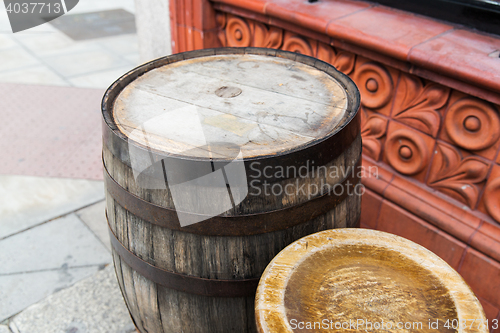 Image of close up of old wooden barrel table outdoors