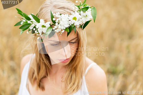 Image of happy woman in wreath of flowers