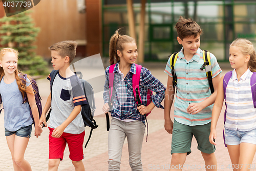 Image of group of happy elementary school students walking