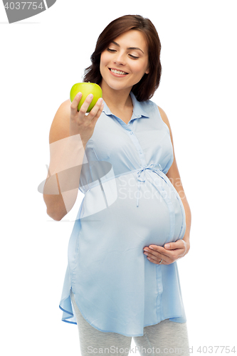 Image of happy pregnant woman looking at green apple