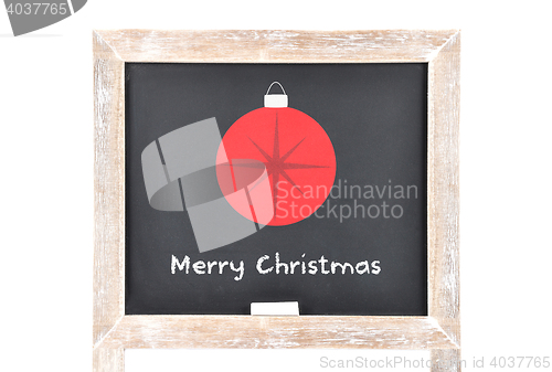Image of Christmas greetings with ball on blackboard