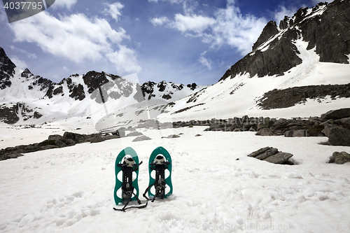 Image of Snowshoes in snow mountain