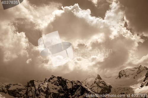 Image of Winter mountain in sunlight clouds