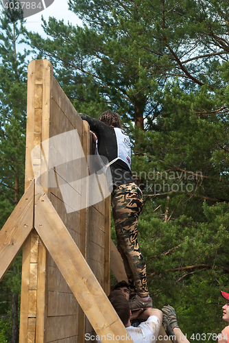 Image of Sportsmen storm wall in extrim race. Tyumen