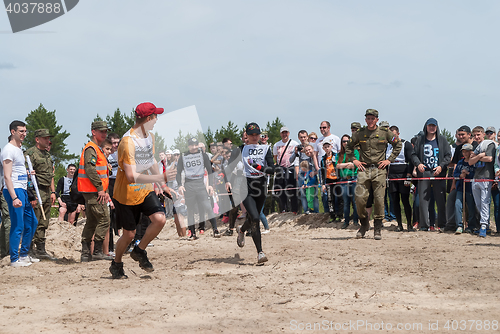 Image of Sportsmen run on last stage in extrim race.Tyumen