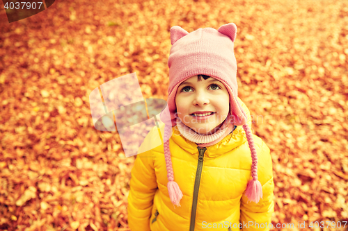 Image of happy little girl in autumn park