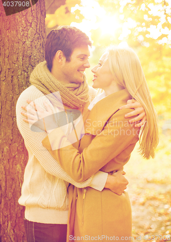 Image of romantic couple kissing in the autumn park