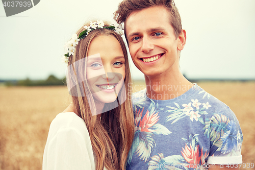 Image of happy smiling young hippie couple outdoors