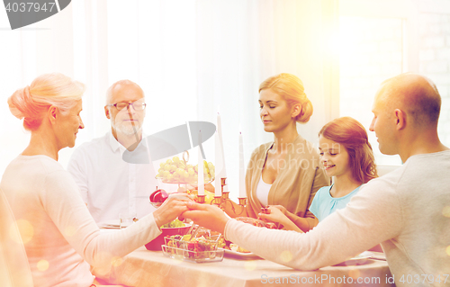 Image of smiling family having holiday dinner at home