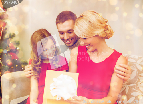 Image of happy family opening gift box