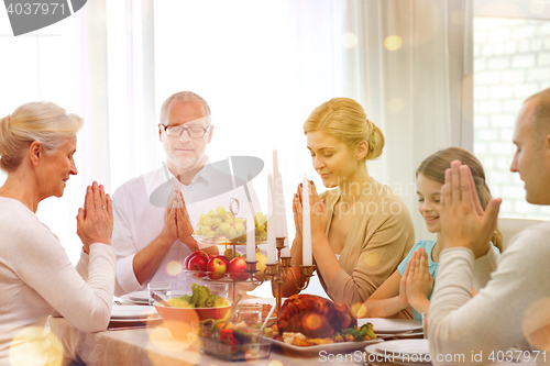 Image of smiling family having holiday dinner at home