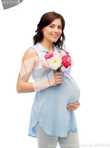 Image of happy pregnant woman with flowers touching belly