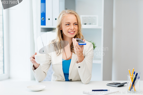 Image of businesswoman using voice command on smartphone