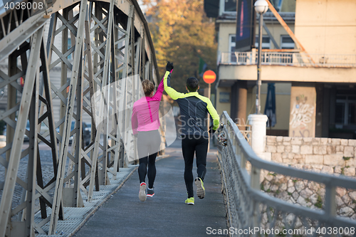 Image of young  couple jogging