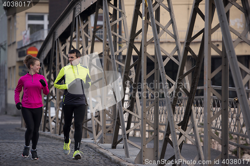 Image of young  couple jogging