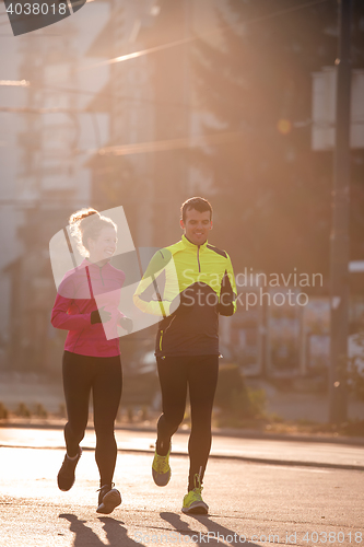 Image of young  couple jogging