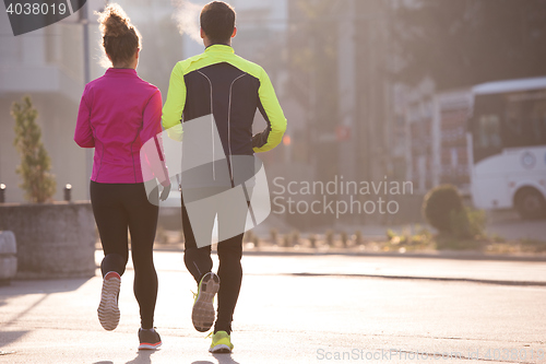 Image of young  couple jogging