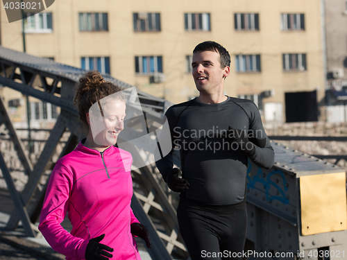 Image of young  couple jogging