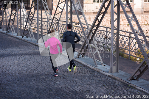 Image of young  couple jogging