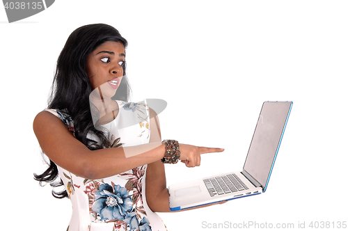 Image of Woman is shocked from laptop screen.