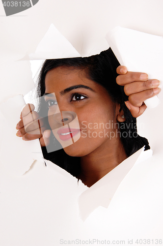 Image of Woman looking through a paper howl.