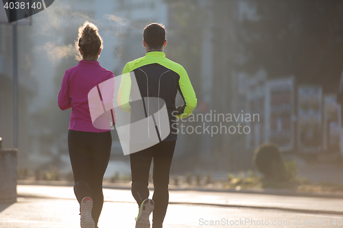 Image of young  couple jogging