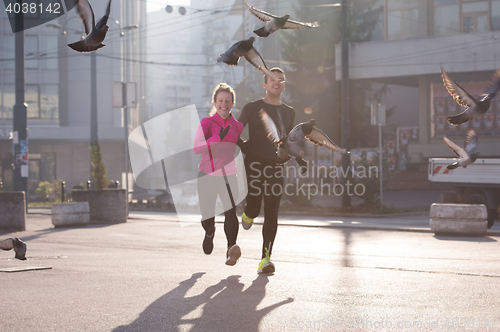 Image of young  couple jogging