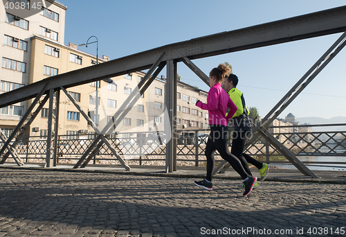 Image of young  couple jogging