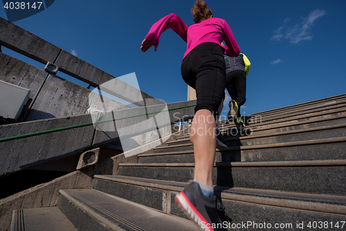 Image of sporty woman jogging on morning