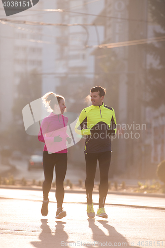 Image of young  couple jogging