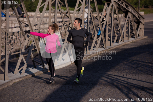 Image of young  couple jogging
