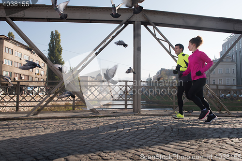 Image of young  couple jogging