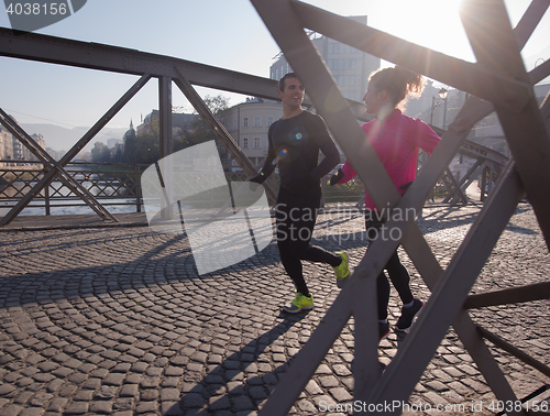 Image of young  couple jogging