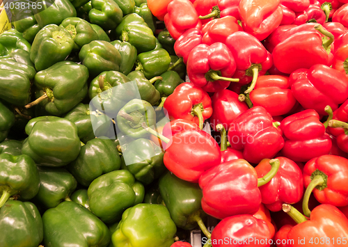 Image of many red and green pepper ready to sale