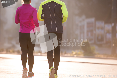 Image of young  couple jogging