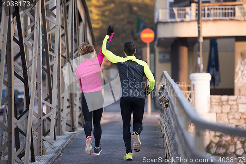 Image of young  couple jogging
