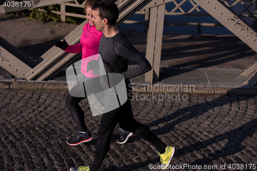 Image of young  couple jogging