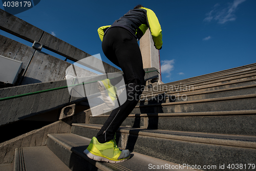 Image of man jogging on steps